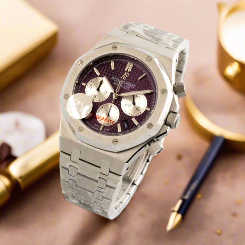 Silver watch with a purple face on a white background